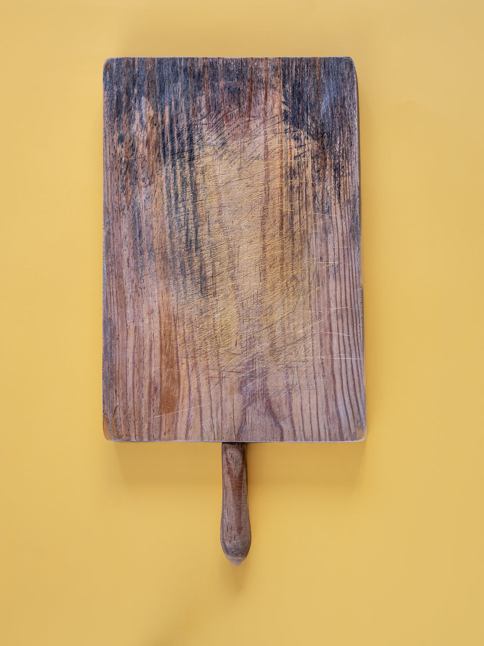 DIRECTLY ABOVE SHOT OF WOODEN TABLE AGAINST WALL