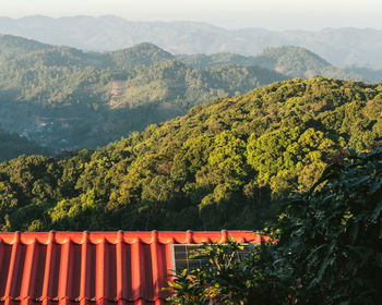 Scenic view of mountains against orange sky