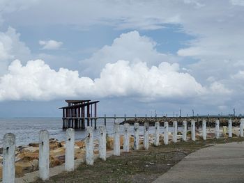 Pier on sea against sky