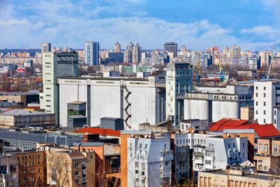 High angle view of buildings in city against sky