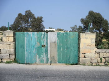 Closed door against sky