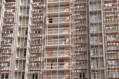 Construction of a skyscraper from metal-concrete elements, close-up