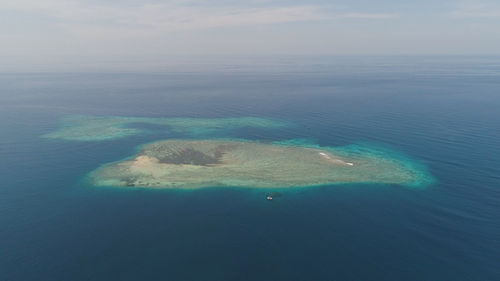 Seascape aerial view coral reef, atoll with turquoise water in atoll, coral reef in ocean waters. 