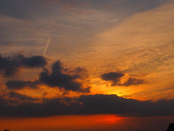 Low angle view of dramatic sky during sunset