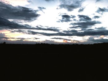 Silhouette landscape against sky during sunset