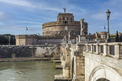 Tevere river and castle sant'angelo in rome with blue sky