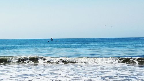 Scenic view of sea against clear sky