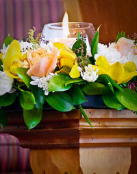 Close-up of flowers and leaves on table