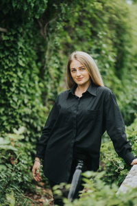 Portrait of a beautiful young woman in forest