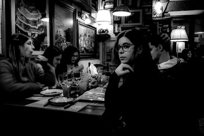 People sitting in restaurant at night