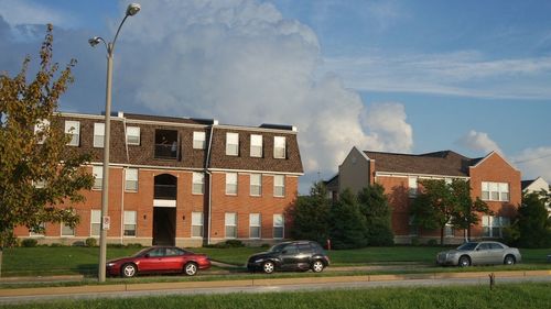 Cars parked on road in front of buildings