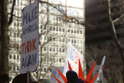 Low angle view of protesting banners against buildings