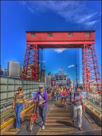 People walking in front of building