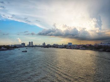 Panoramic view of sea and buildings against sky