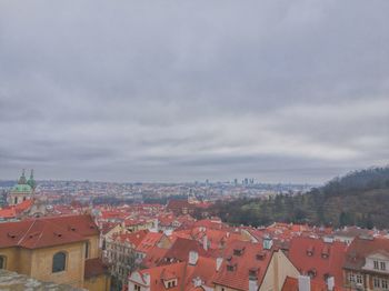 Houses in city against sky