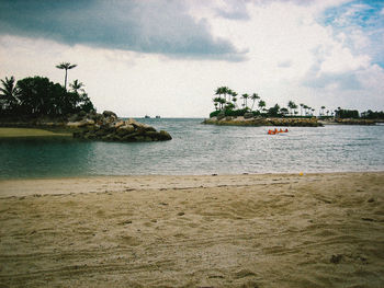 Scenic view of sea against cloudy sky