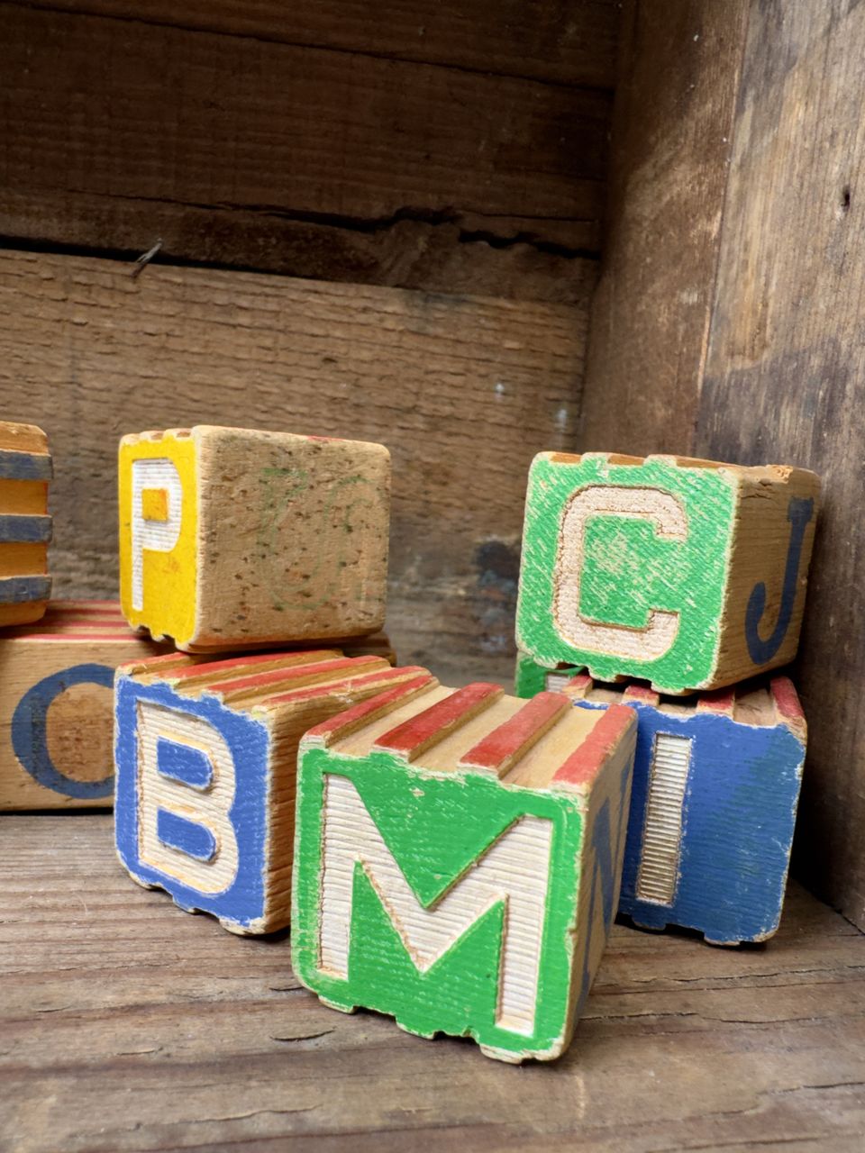 toy block, wood, toy, multi colored, block, indoors, green, block shape, no people, alphabet, text, still life, variation, communication