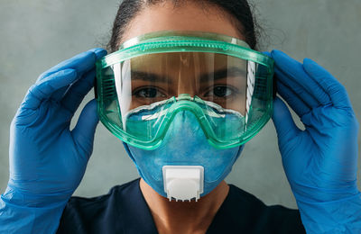 Close-up portrait of man wearing mask