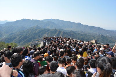 Group of people looking at mountain range