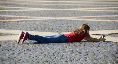 Woman lying down while lying down on steps