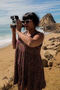 Woman standing on beach