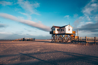 House by building against sky