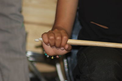 Close-up of man playing guitar