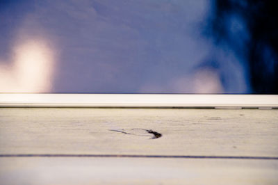 Close-up of railing against sky