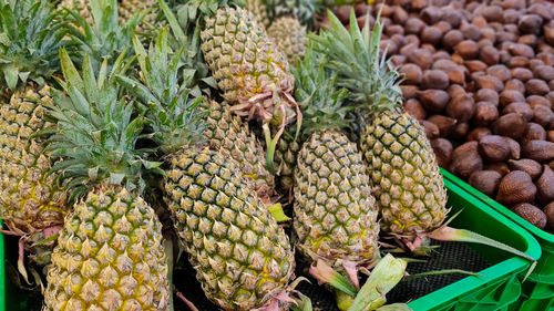 Pineapple for sale at market stall