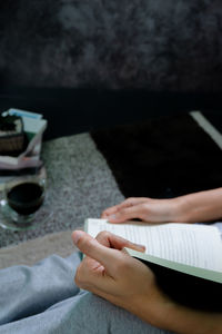 High angle view of woman reading book