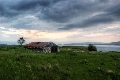 House on field against sky