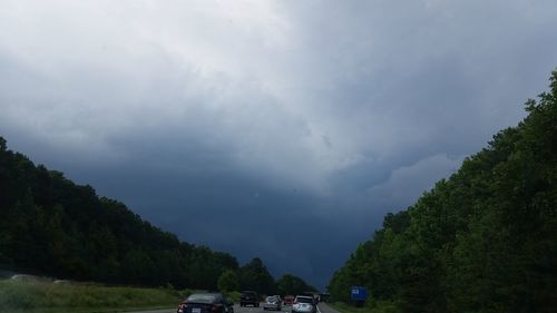 View of road against cloudy sky