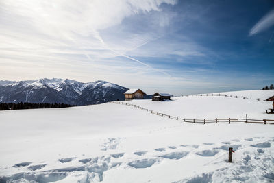 Scenic view of snow covered mountains against sky