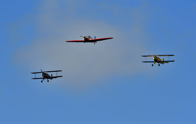 Low angle view of airplane flying against clear sky