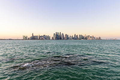 View of sea with city in background