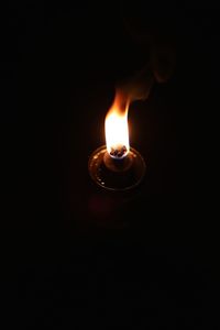 Close-up of lit candle