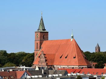 Exterior of church against clear sky in city