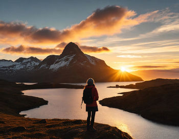 Adventurer's silhouette. a vibrant sunset. sky evoke a sense of wanderlust. beauty of solitude.