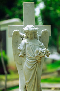 Statue of angel at cemetery