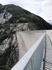 High angle view of dam on mountain against sky