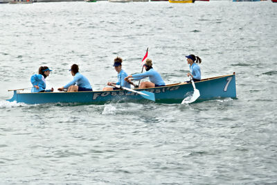 People on boat in sea