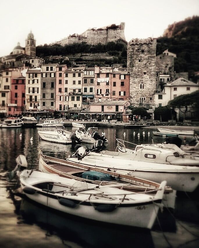 building exterior, architecture, transportation, nautical vessel, built structure, mode of transport, moored, water, city, outdoors, day, no people, residential building, harbor, sky, cityscape, gondola - traditional boat, yacht