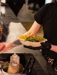 Midsection of man preparing food at restaurant