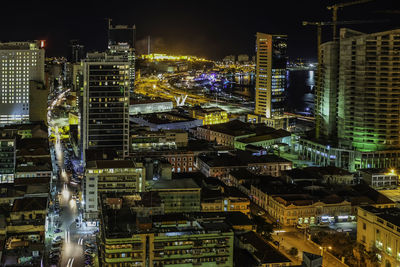 High angle view of illuminated buildings in city at night