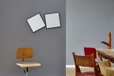 Empty chairs and table against wall at home