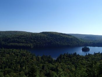 Scenic view of mountains against clear blue sky
