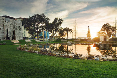 Scenic view of river against cloudy sky