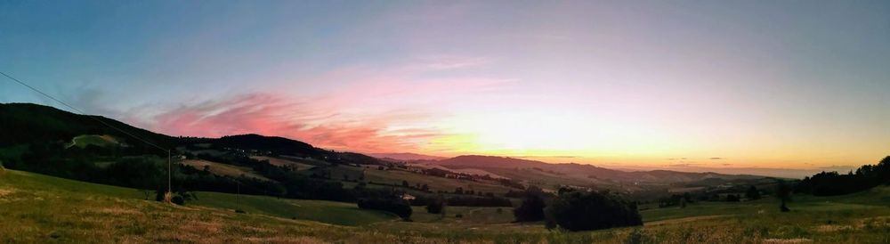 Scenic view of landscape against sky during sunset