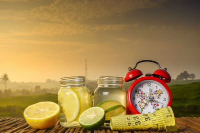 Fruits in glass jar on table