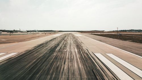 Panoramic view of airport runway against sky